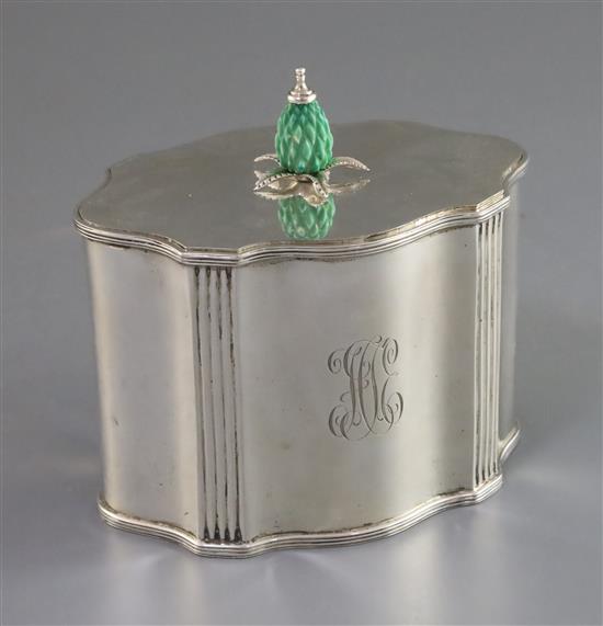 An Edwardian silver serpentine tea caddy with stained carved ivory knop, by James Parkes, gross 10 oz.